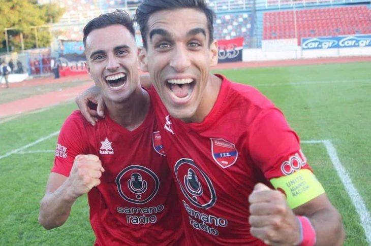 Greek international left-back and captain of Panionios FC Giannis Kontoes (right) celebrates with a teammate during training