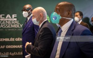 President of the International Federation of Football Association (FIFA) Gianni Infantino (2-L) and the president of the CAF Patrice Motsepe (R) arrive at the 43rd CAF General Assembly, on March 12, 2021, in the Moroccan capital Rabat