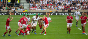 Welsh players attempt to tackle Courtney Lawes