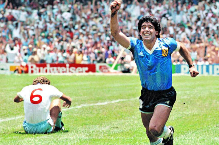 A jubilant Maradona wheels away after netting his second goal against England in 1986.