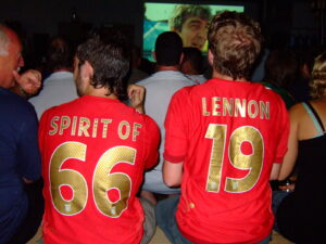 Two England Fans in 2006. One sports an "Aaron Lennon 19" shirt, the other says "spirit of 66."
