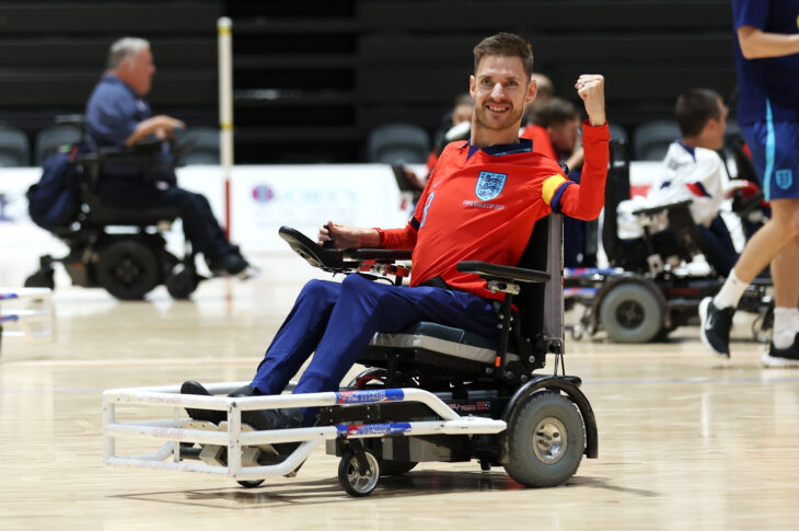 SYDNEY, AUSTRALIA - OCTOBER 20: Jonathan Bolding of England celebrates victory during the 2023 FIPFA Powerchair World Cup semi final match between England and United States of America at the Quay Centre on October 20, 2023 in Sydney, Australia.