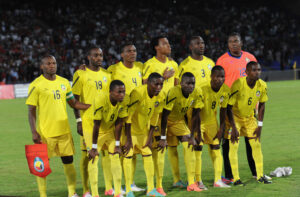 Mozambique team pose in their yellow strips ahead of a game