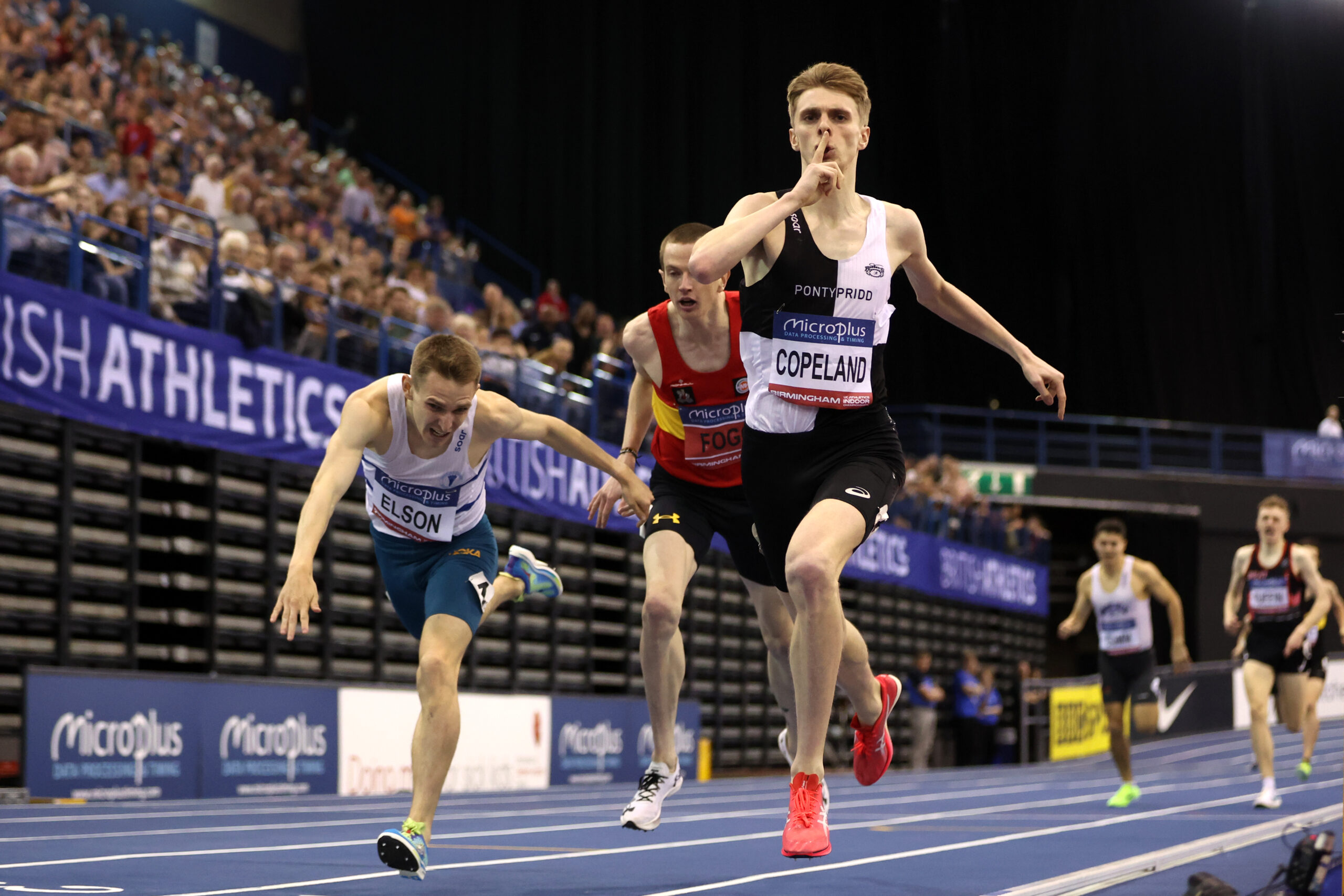 BIRMINGHAM, ENGLAND - FEBRUARY 18: Silver medalist, Callum Elson (L), Bronze medalist, Adam Fogg (C), and Gold medalist, Piers Copeland of Great Britain (R) cross the line in the Men's 1500m Final during day two of the 2024 Microplus UK Athletics Indoor Championships at Utilita Arena Birmingham on February 18, 2024 in Birmingham, England. 