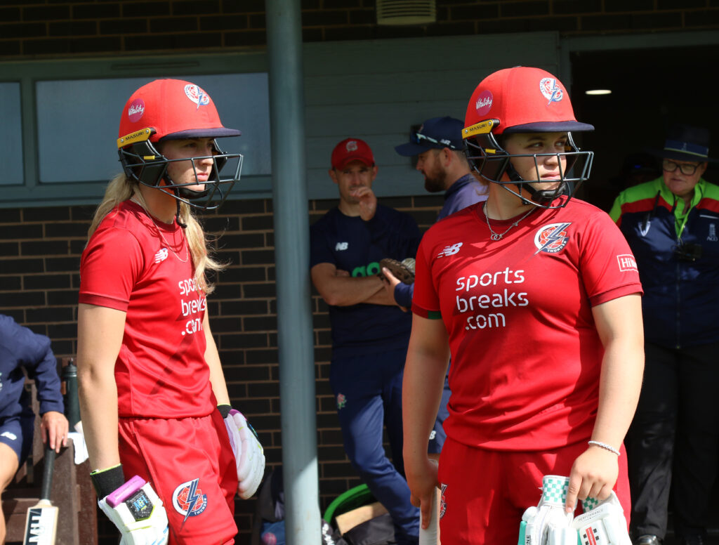 Seren Smale in cricket kit with Thunder teammate