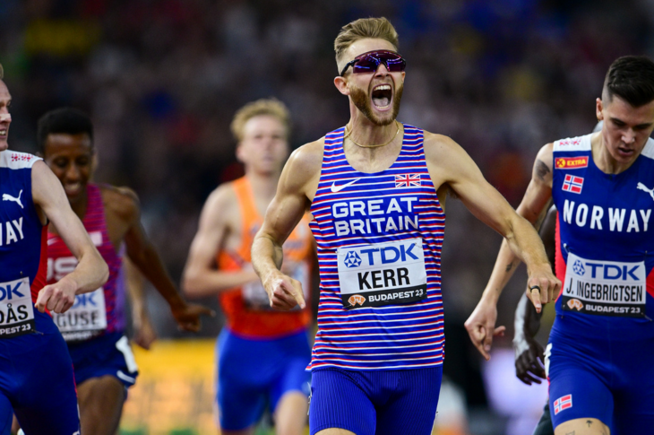 Josh Kerr screams as he crosses the finish line in the 1st at the 2023 World Athletics 1500m final.
