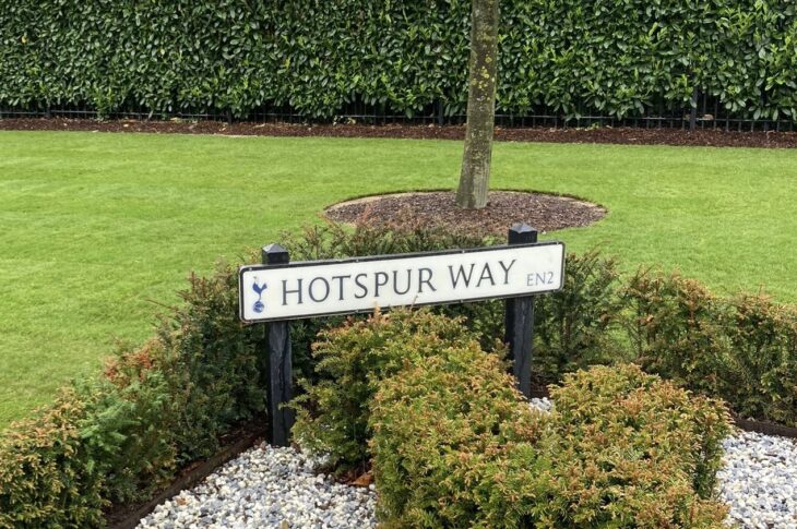 A photo of the street sign saying "Hotspur Way" with a plush green background at Spurs' training facilities